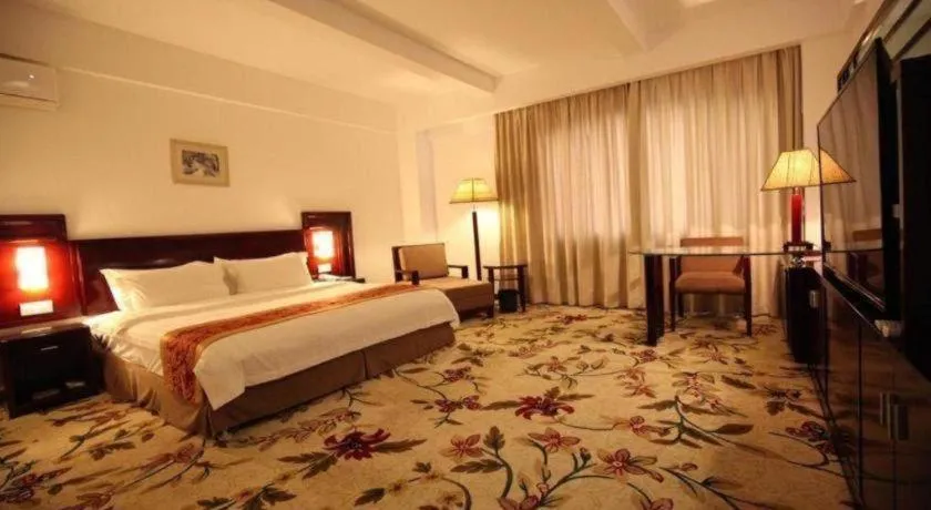 Bed in Hong Ye Hotel