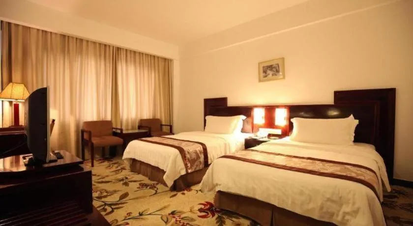 Bed in Hong Ye Hotel