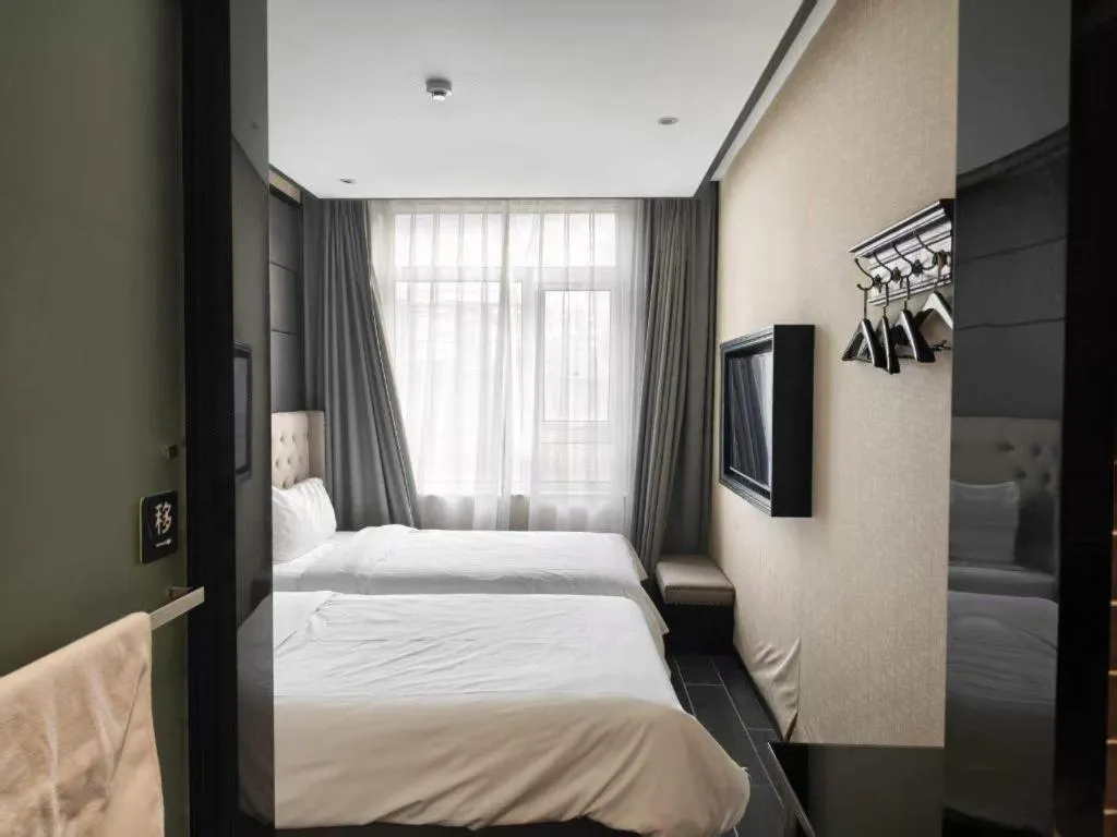 Bed in Xana Hotelle Beijing Fengtai Railway Station Tiantan Hospital