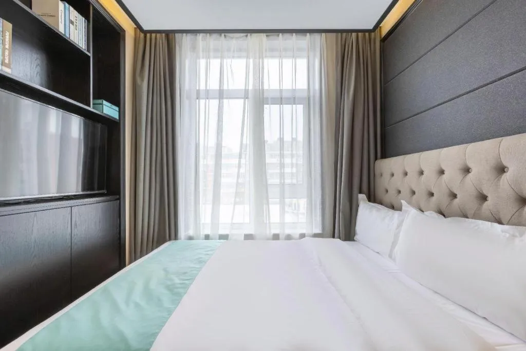 Bed in Xana Hotelle Beijing Fengtai Railway Station Tiantan Hospital