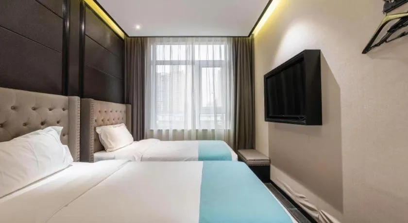 Bed in Xana Hotelle Beijing Fengtai Railway Station Tiantan Hospital