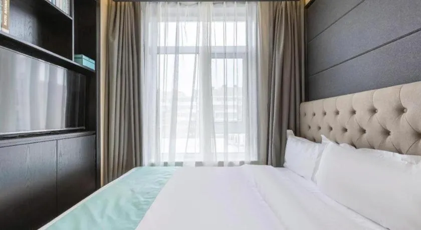 Bed in Xana Hotelle Beijing Fengtai Railway Station Tiantan Hospital