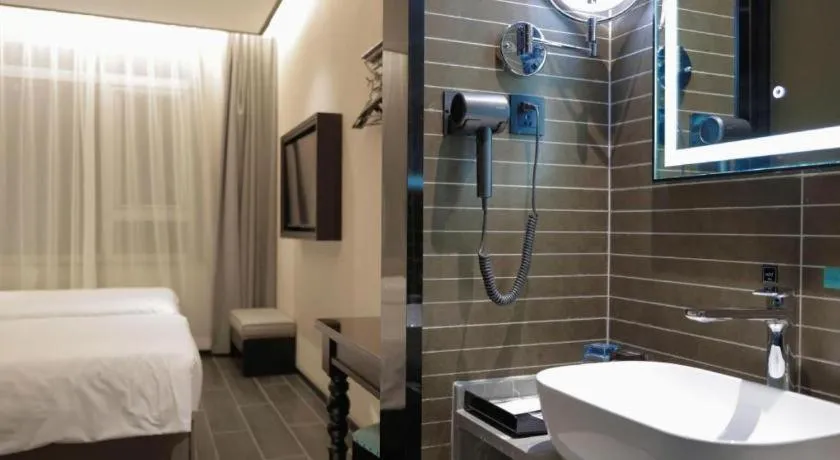 Bed in Xana Hotelle Beijing Fengtai Railway Station Tiantan Hospital