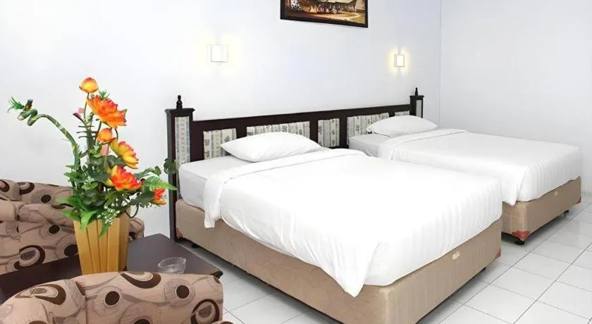 Bed in Toba Beach Hotel