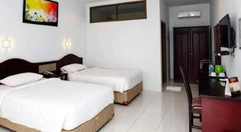 Bed in Toba Beach Hotel