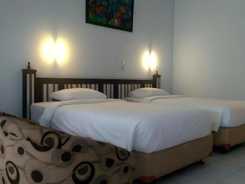 Bed in Toba Beach Hotel