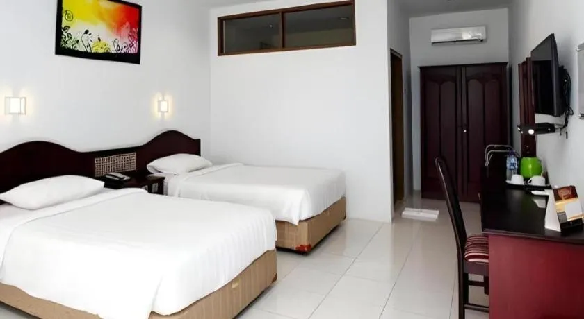 Bed in Toba Beach Hotel