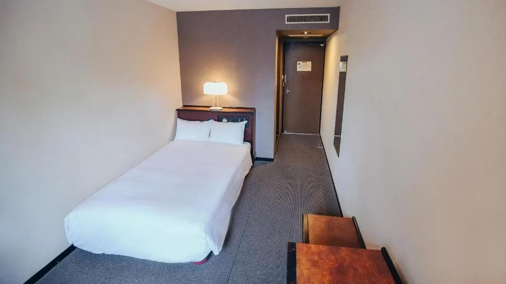 Bed in Hotel Areaone Miyazaki