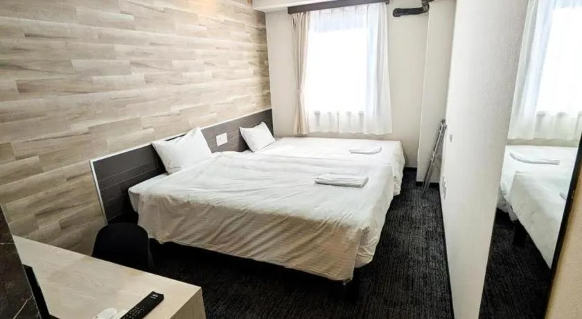 Bed in Hotel Areaone Miyazaki