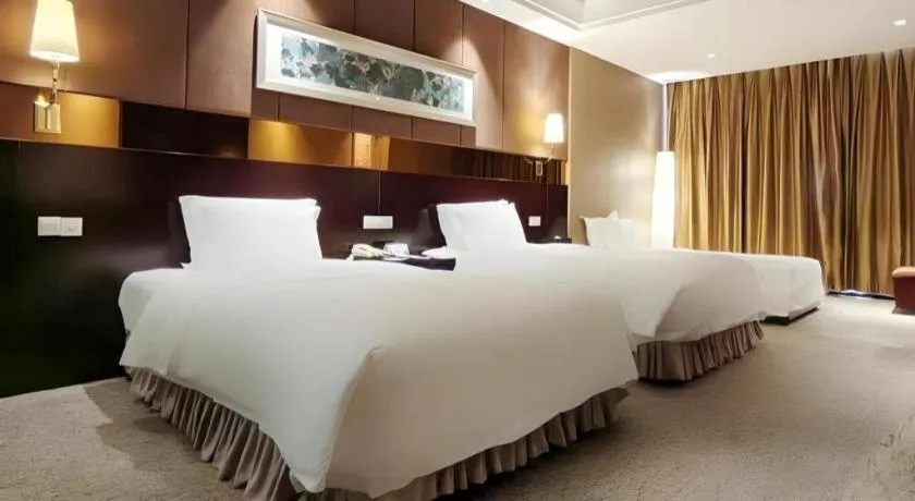 Bed in Xian Grand Soluxe International Hotel
