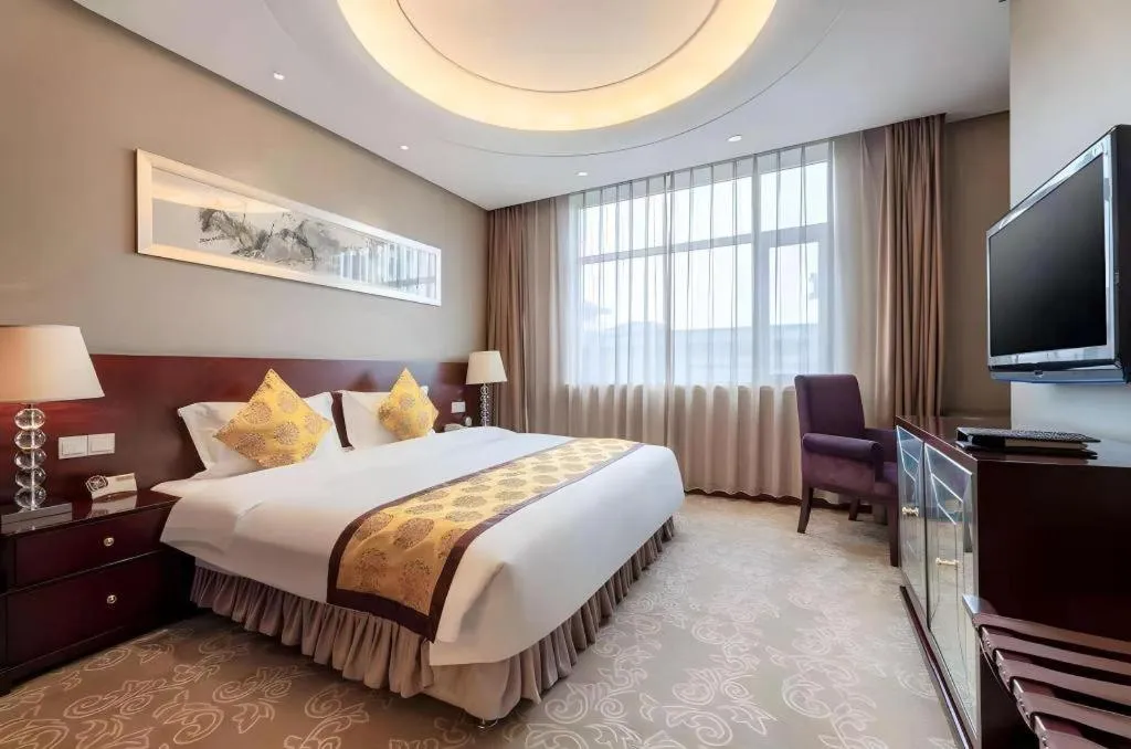 Bed in Xian Grand Soluxe International Hotel