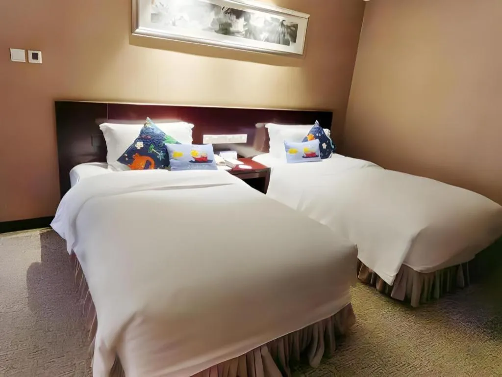 Bed in Xian Grand Soluxe International Hotel