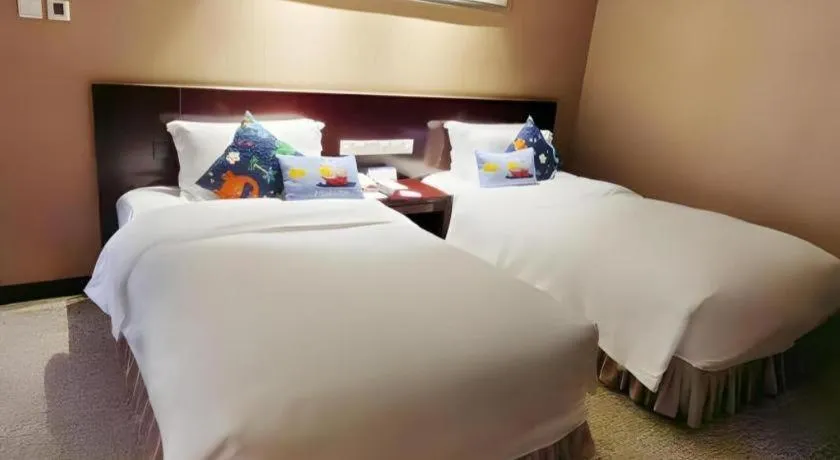 Bed in Xian Grand Soluxe International Hotel