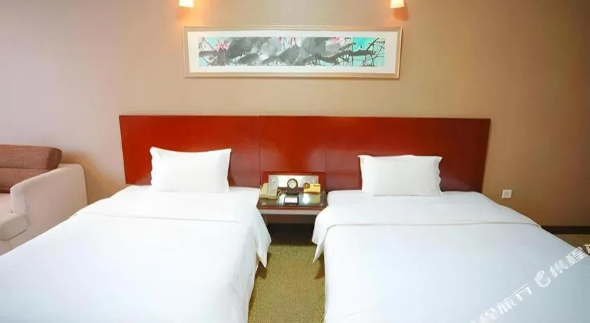 Bed in Xian Grand Soluxe International Hotel