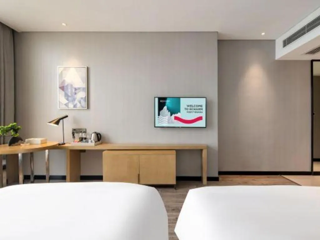 Bed in Echarm Hotel Baise Sports Center Dream Island Plaza