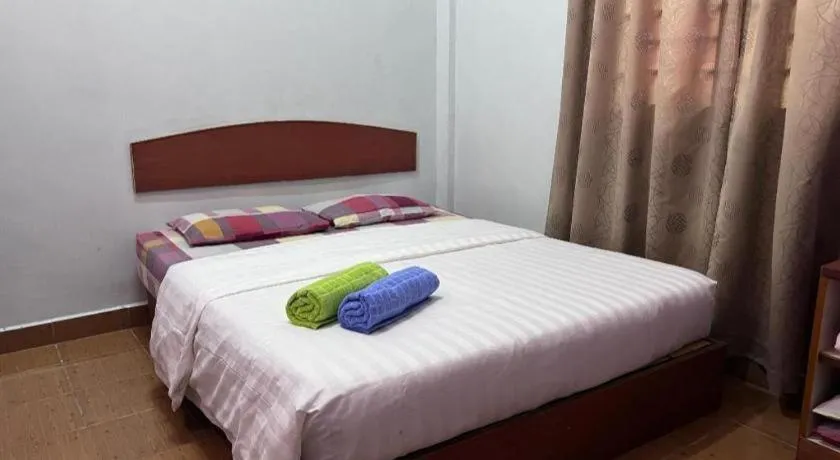 Bed in OYO 90967 Homestay Chalet Warisan Siti