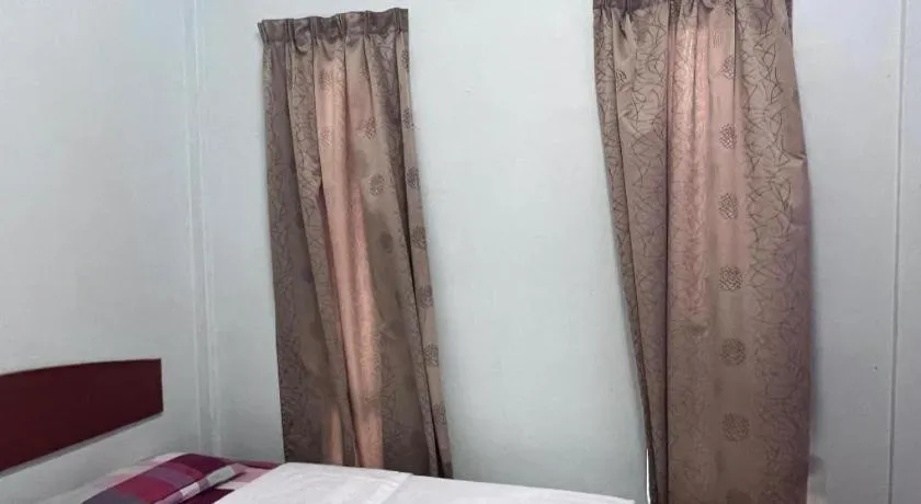 Bed in OYO 90967 Homestay Chalet Warisan Siti