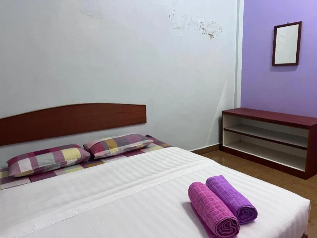 Bed in OYO 90967 Homestay Chalet Warisan Siti