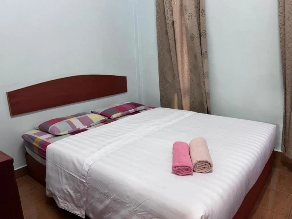 Bed in OYO 90967 Homestay Chalet Warisan Siti
