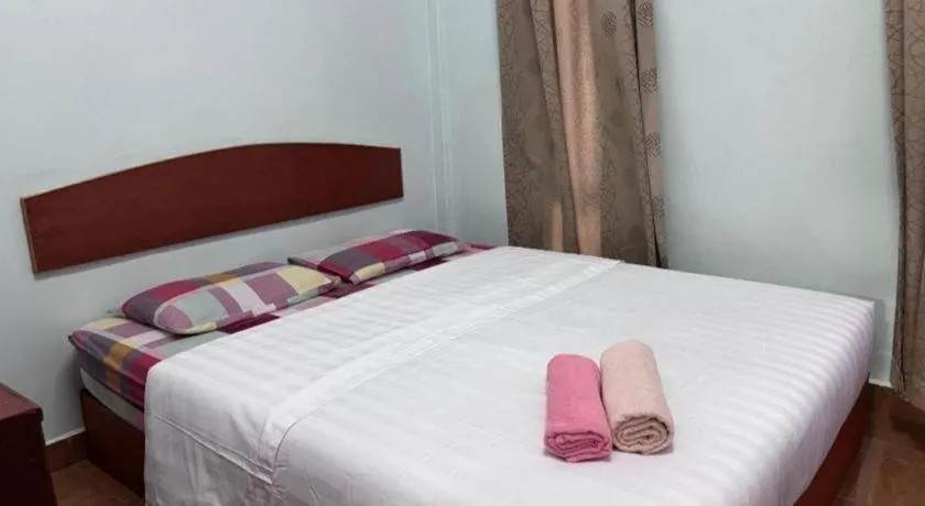 Bed in OYO 90967 Homestay Chalet Warisan Siti