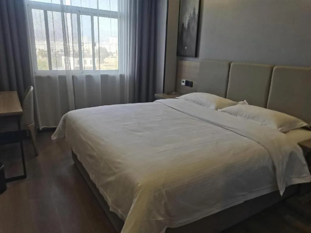 Bed in GreenTree Inn Anqing Tongcheng South Shengtang Road Shengtang International Business Hotel