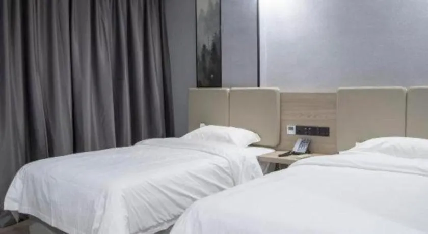 Bed in GreenTree Inn Anqing Tongcheng South Shengtang Road Shengtang International Business Hotel