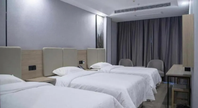Bed in GreenTree Inn Anqing Tongcheng South Shengtang Road Shengtang International Business Hotel