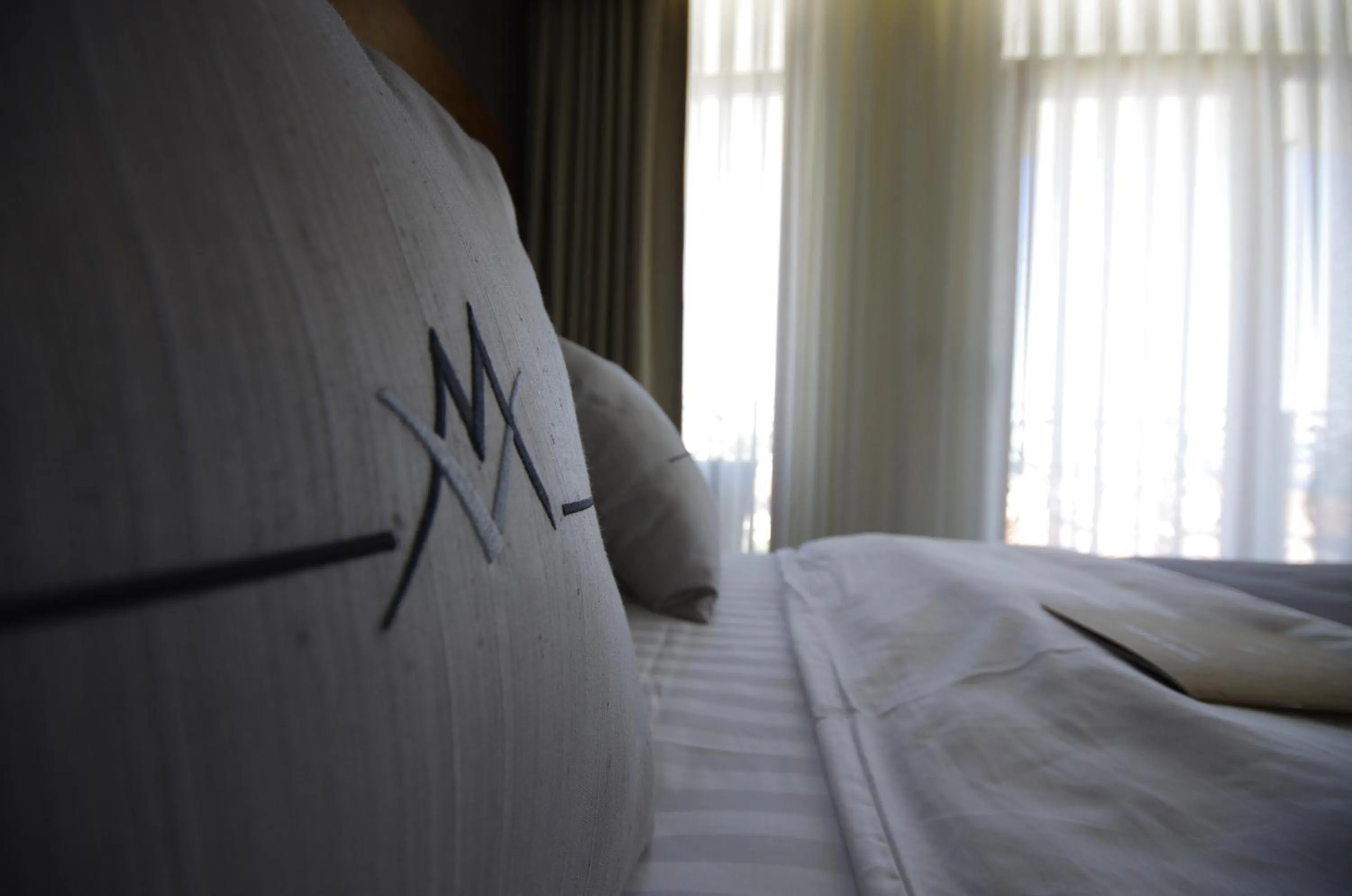 Decorative detail, Bed in Maison Vourla Hotel
