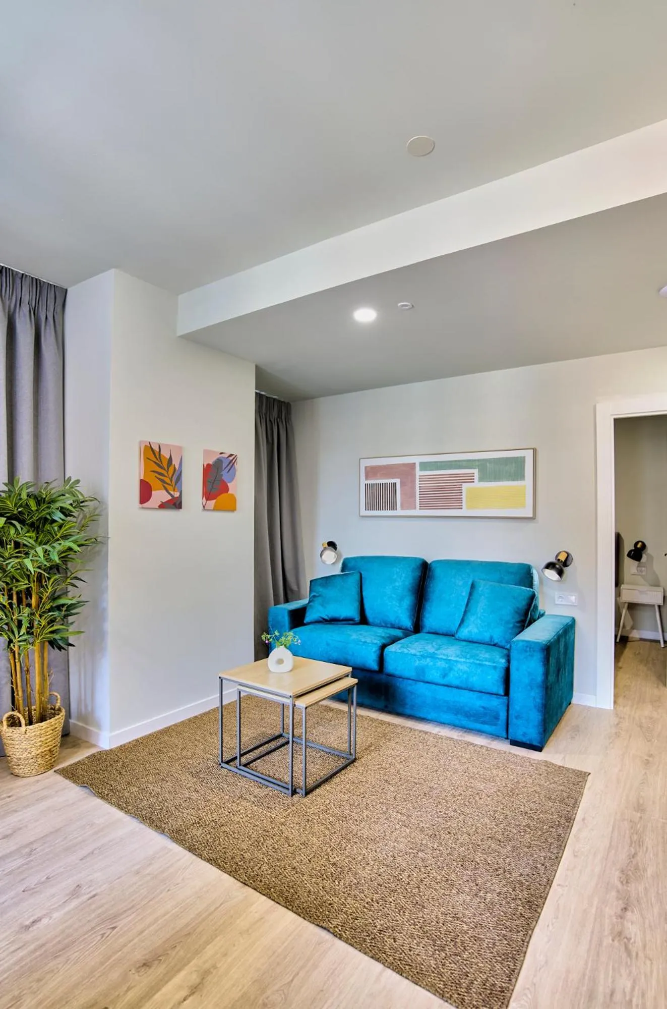 Living room in Apartamentos Olivia by gaiarooms