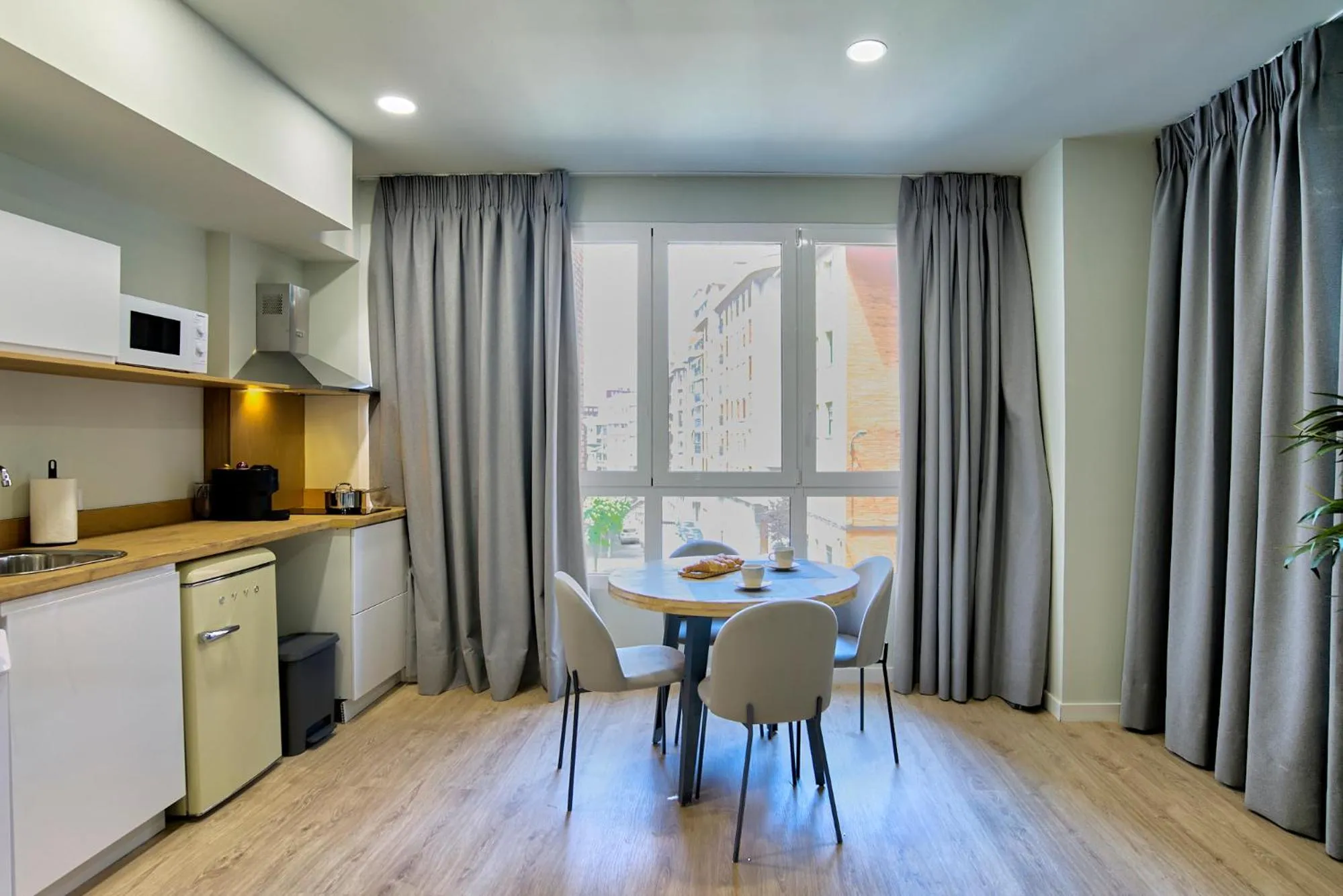 Dining area in Apartamentos Olivia by gaiarooms