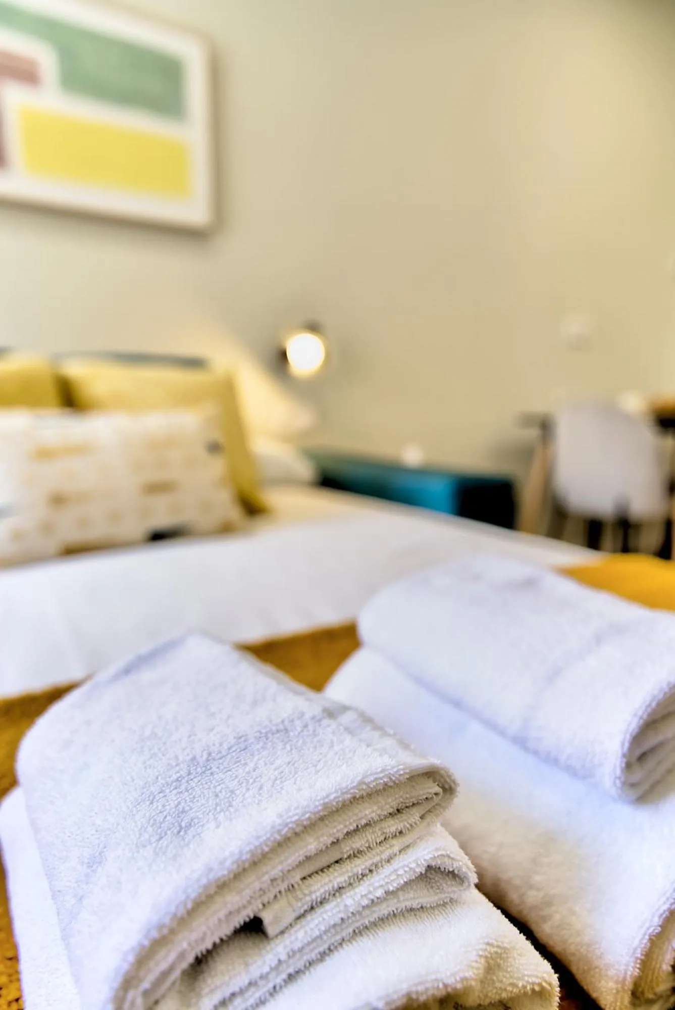 towels, Bed in Apartamentos Olivia by gaiarooms