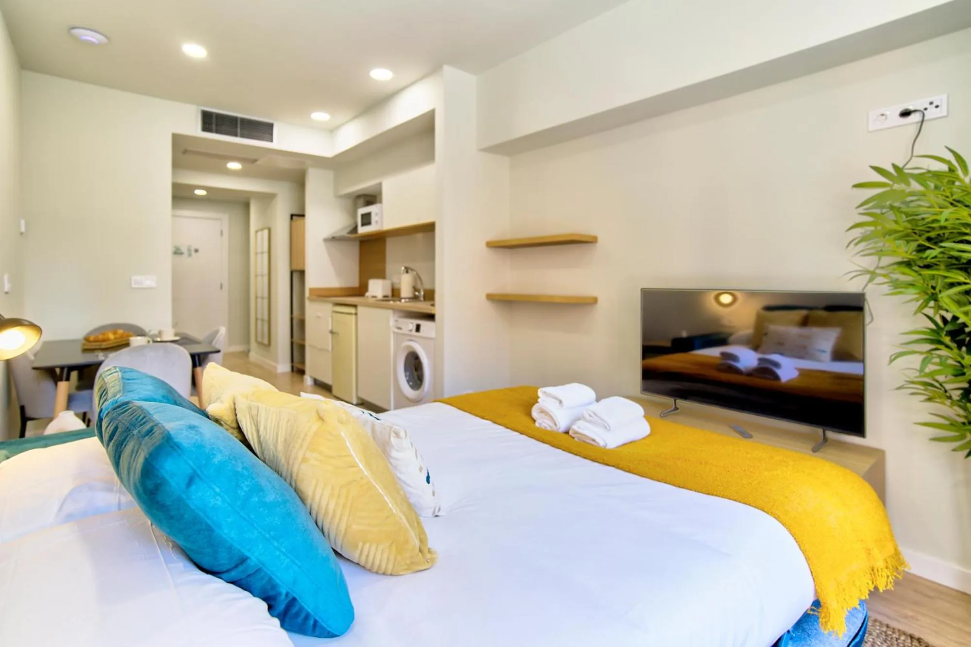 Bed in Apartamentos Olivia by gaiarooms