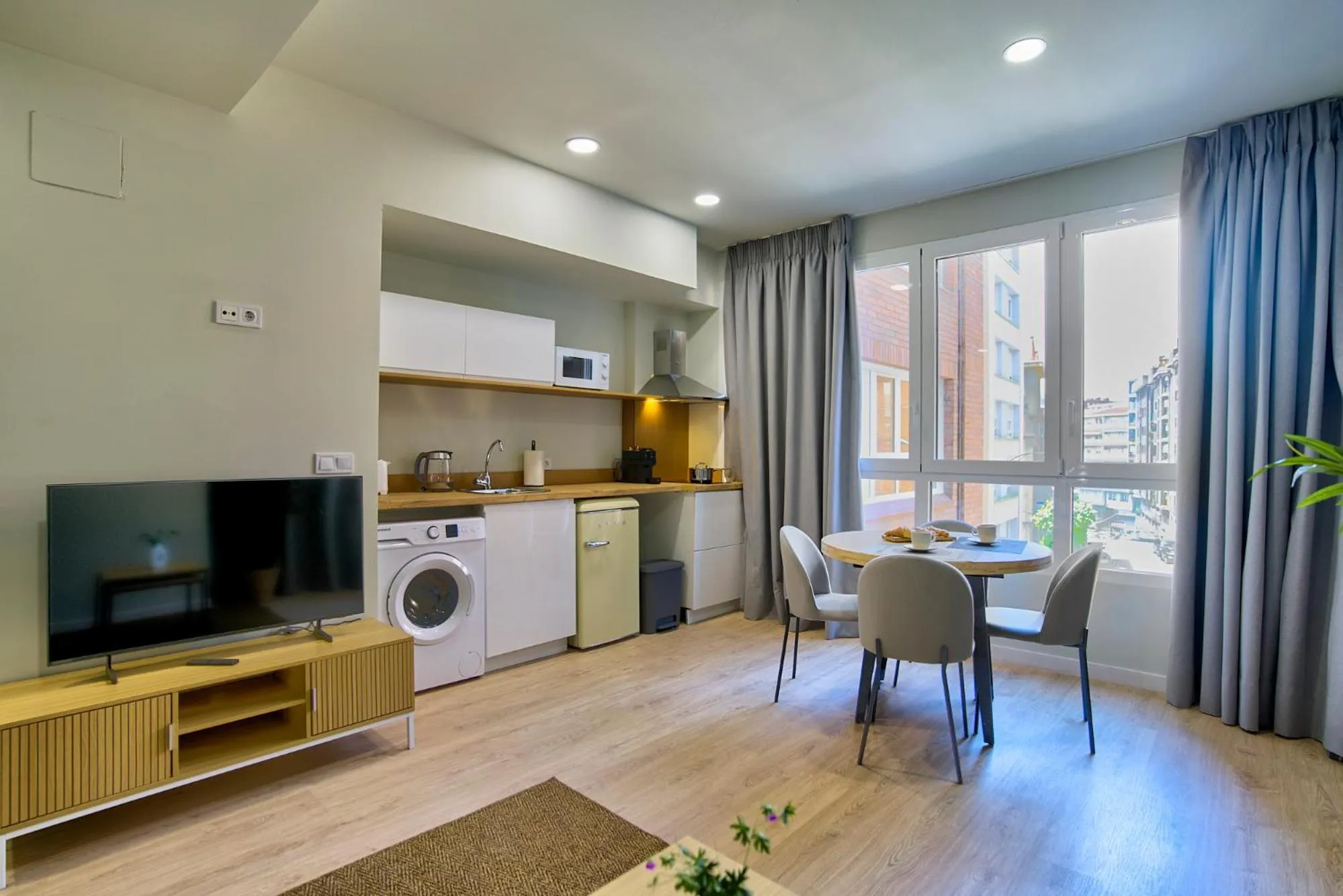 TV and multimedia in Apartamentos Olivia by gaiarooms