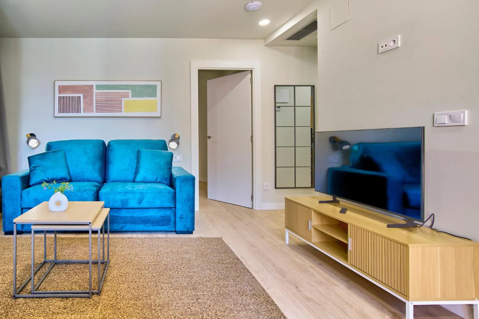 TV and multimedia in Apartamentos Olivia by gaiarooms