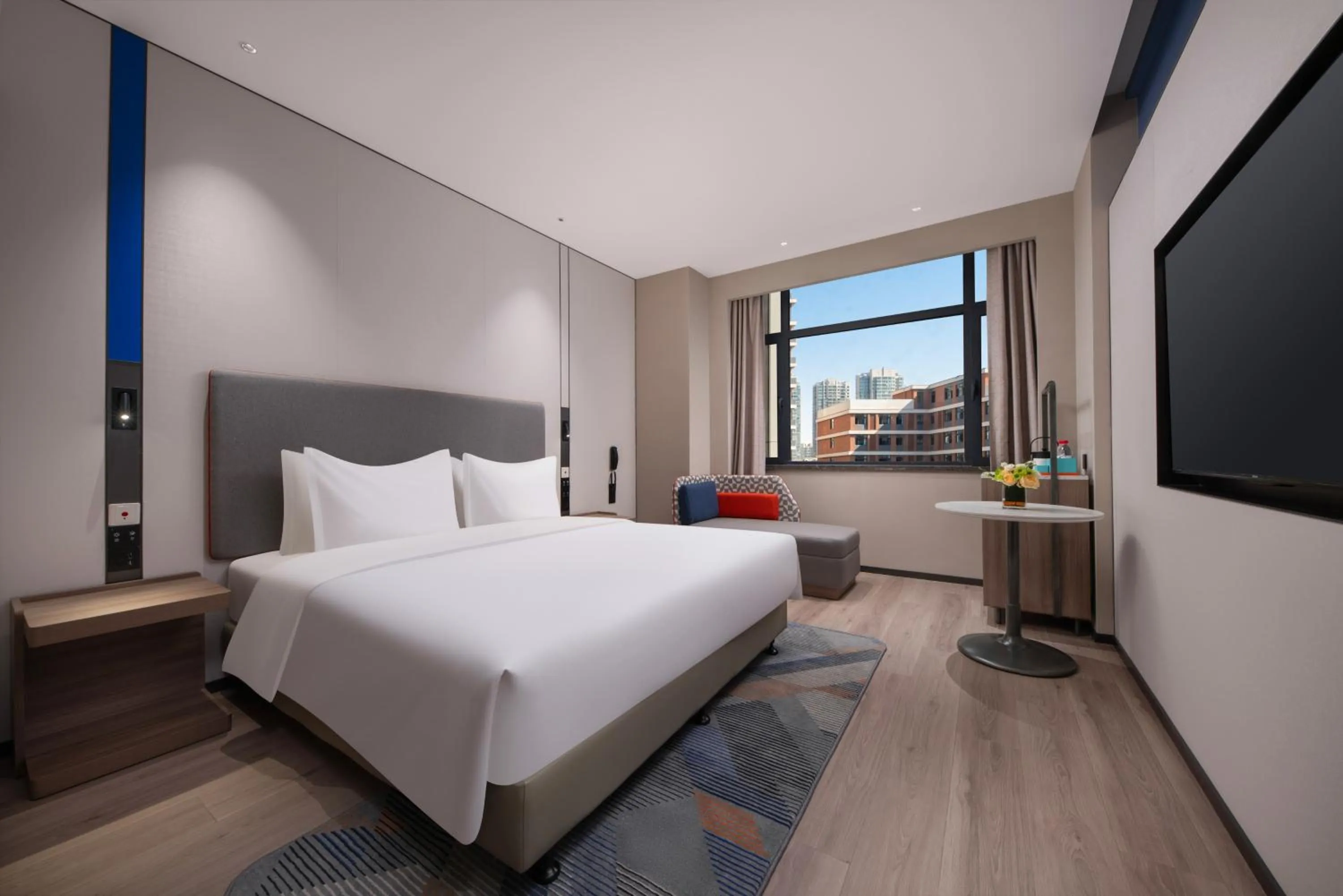 Bed in Holiday Inn Express Qingdao City Balcony by IHG