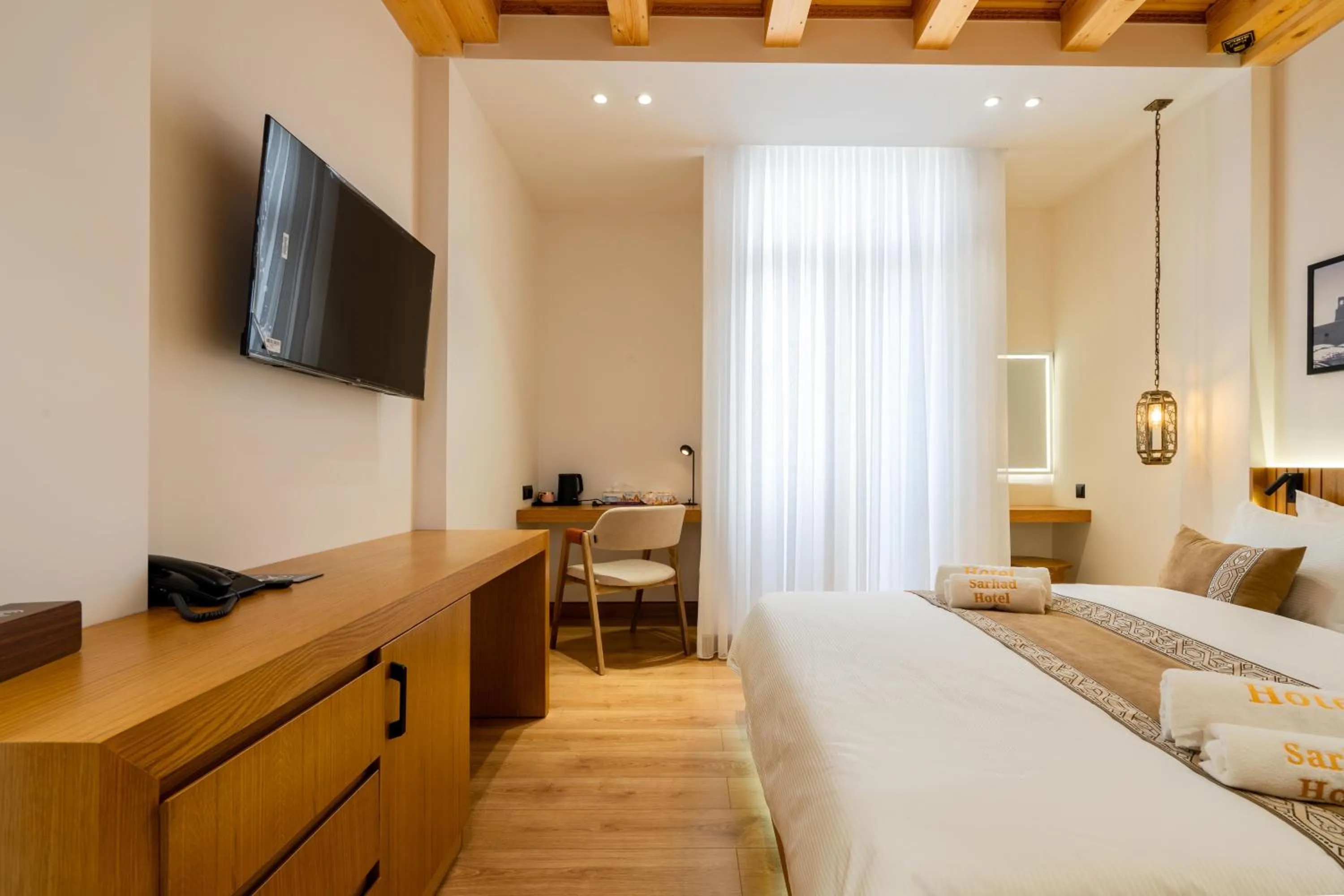 Photo of the whole room, Bed in Sarhad Hotel