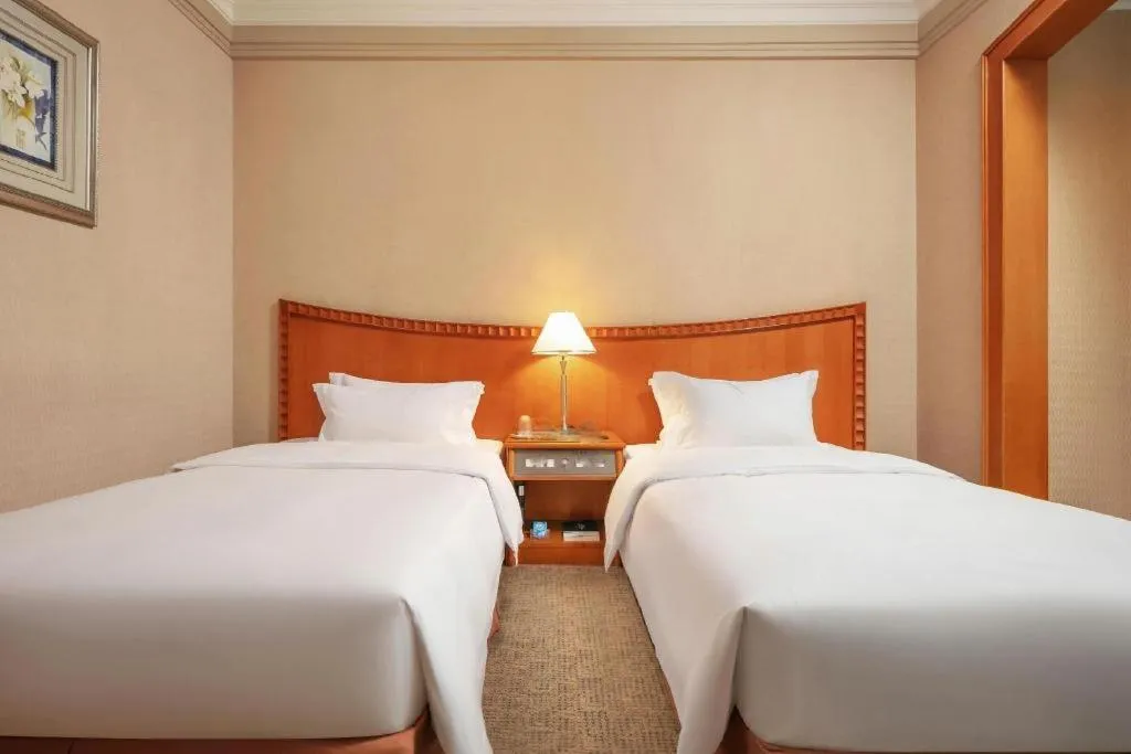 Bed in Haihua Hotel Hangzhou