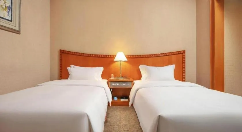 Bed in Haihua Hotel Hangzhou