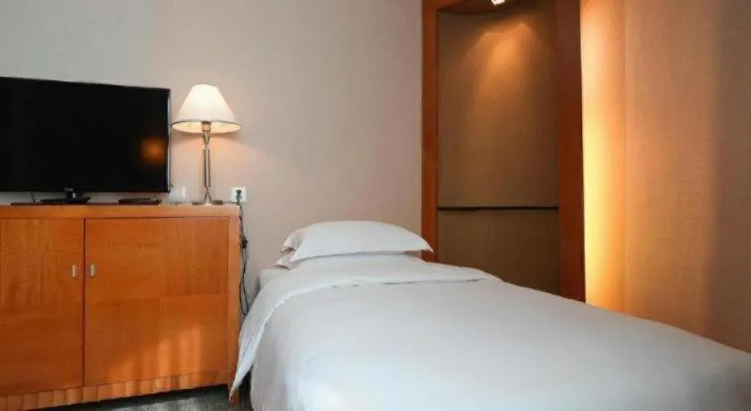 Bed in Haihua Hotel Hangzhou