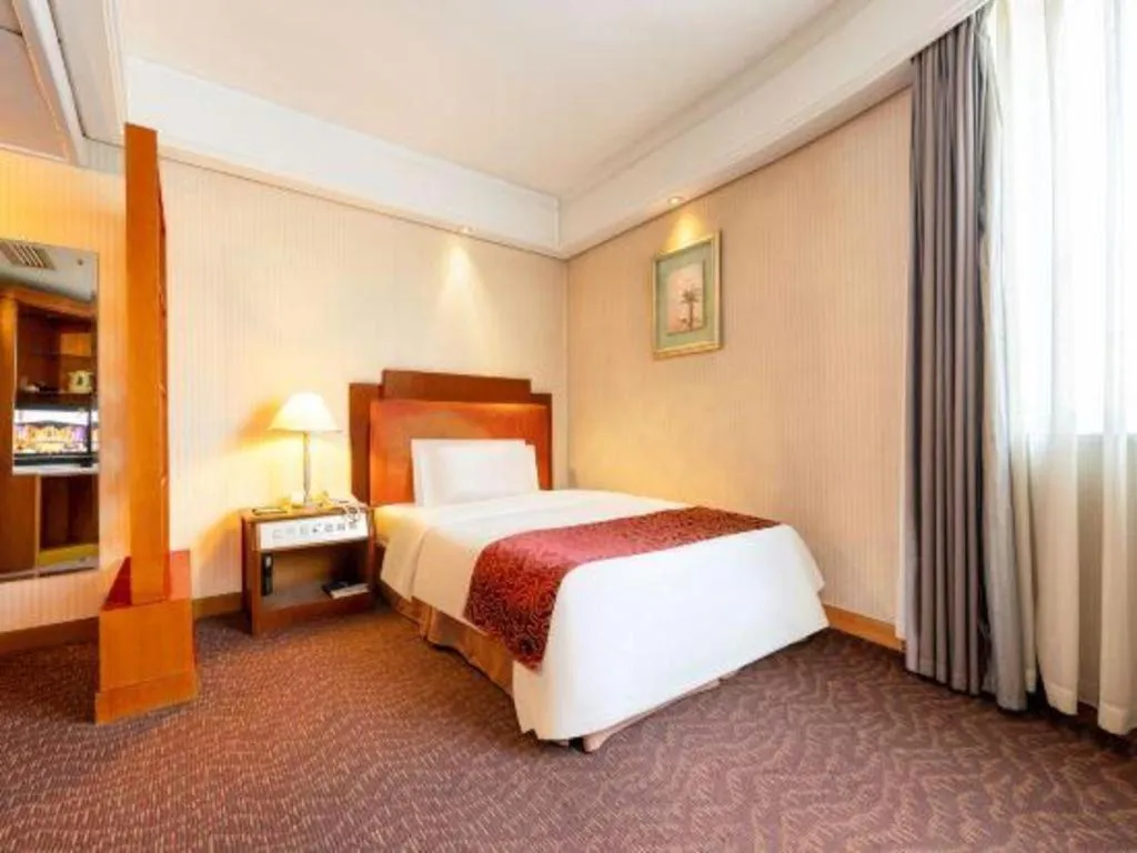 Bed in Haihua Hotel Hangzhou