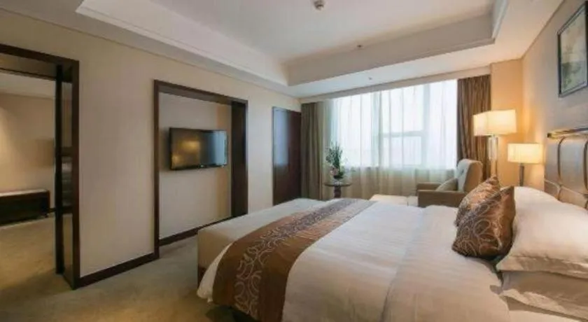 Bed in Maison New Century Hotel Ningbo