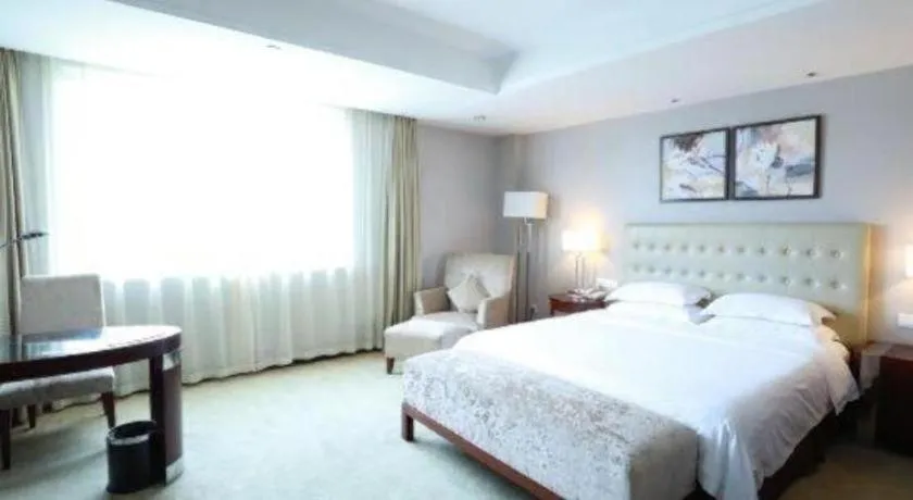 Bed in Maison New Century Hotel Ningbo