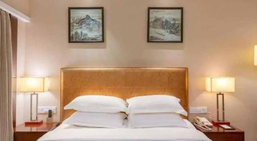 Bed in Maison New Century Hotel Ningbo