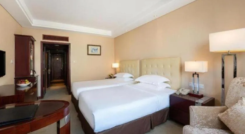 Bed in Maison New Century Hotel Ningbo