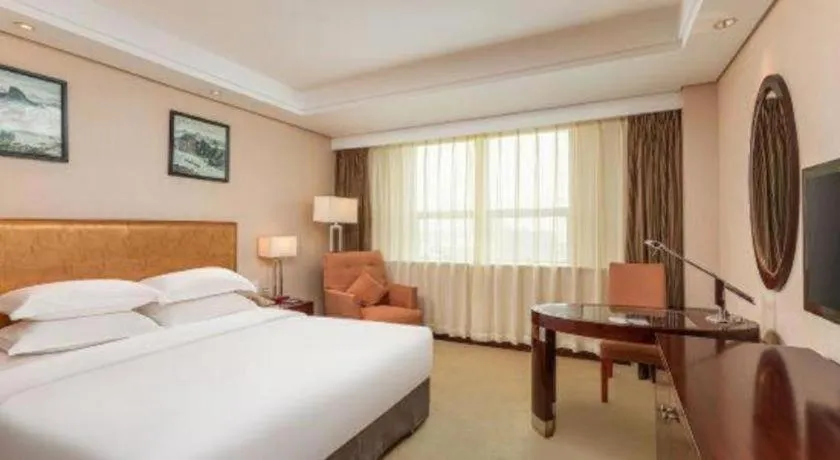 Bed in Maison New Century Hotel Ningbo