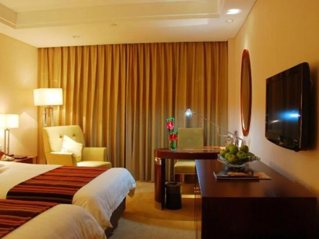 Bed in Maison New Century Hotel Ningbo