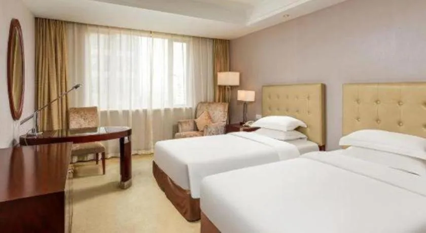 Bed in Maison New Century Hotel Ningbo