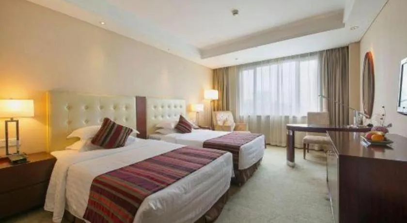 Bed in Maison New Century Hotel Ningbo