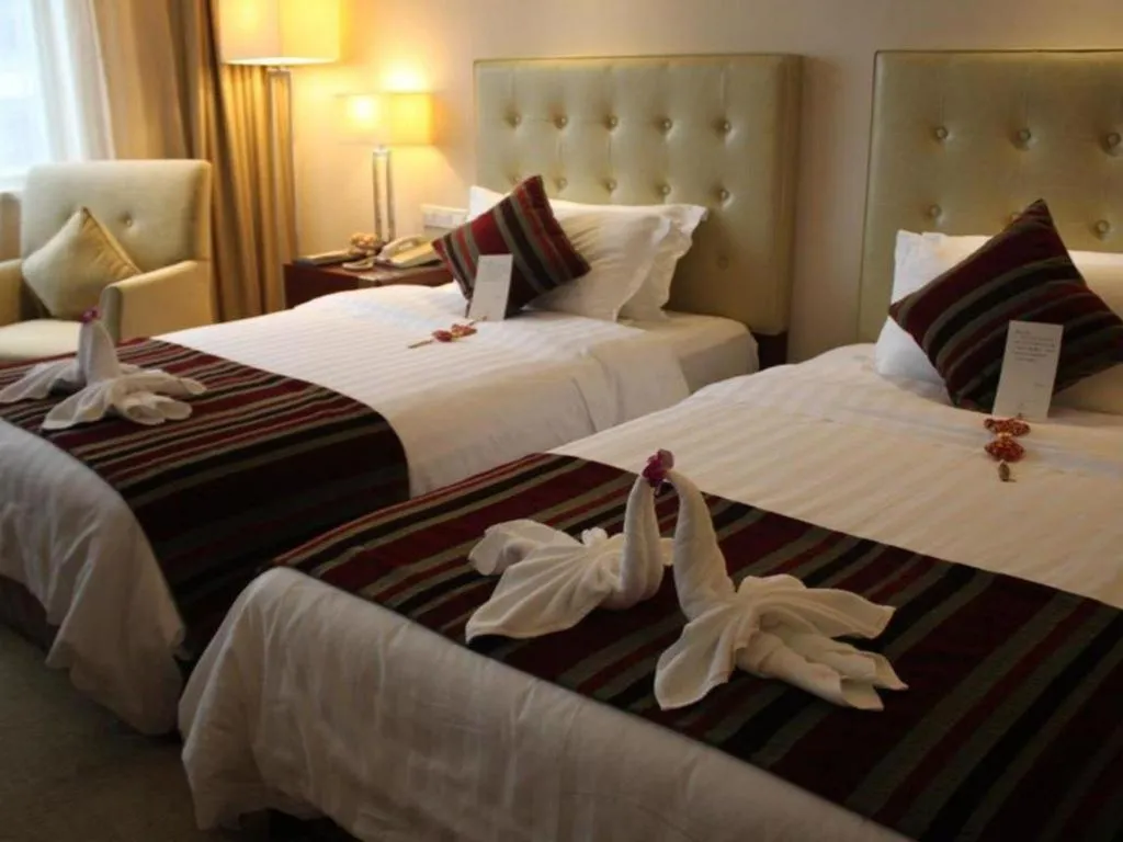 Bed in Maison New Century Hotel Ningbo