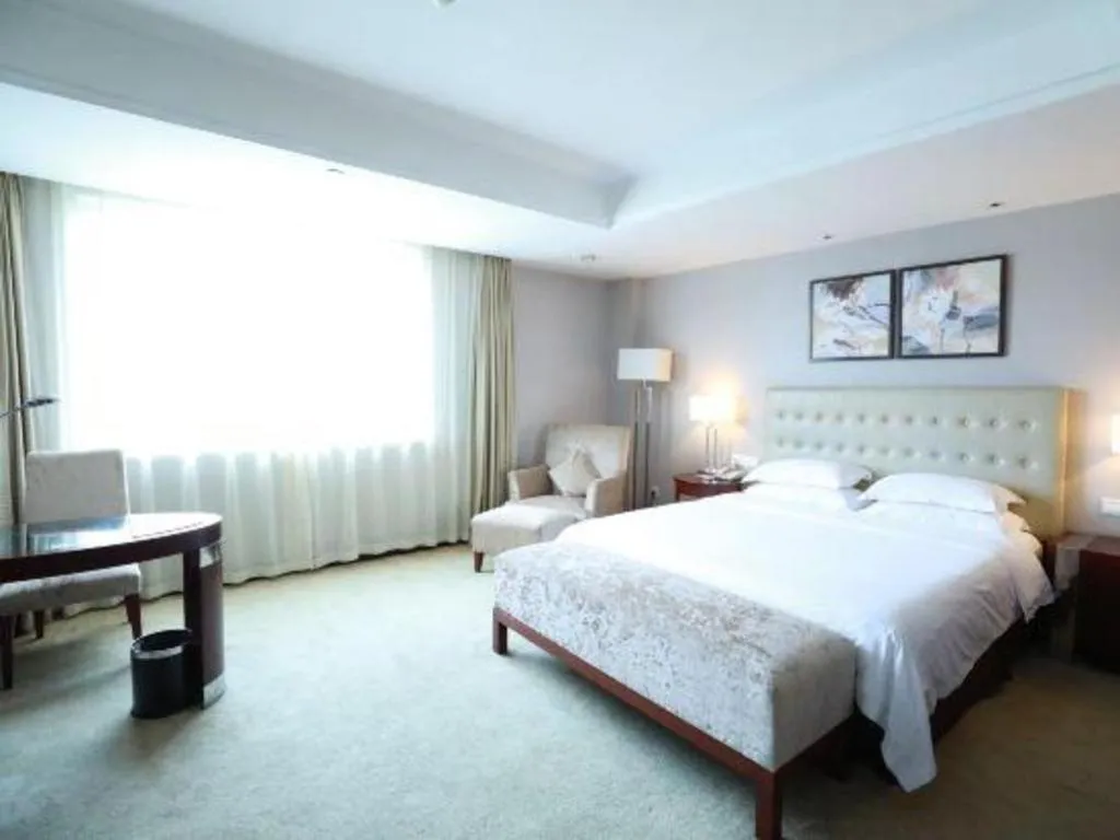 Bed in Maison New Century Hotel Ningbo